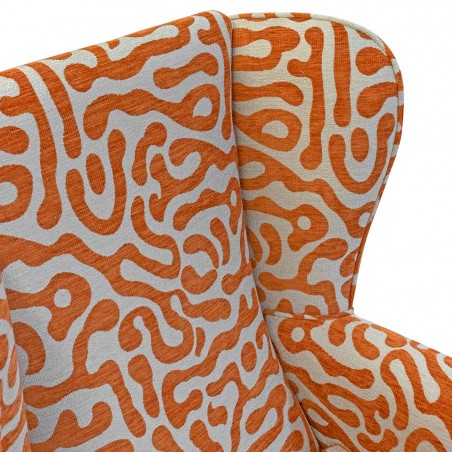 Orange and beige patterned fabric armchair