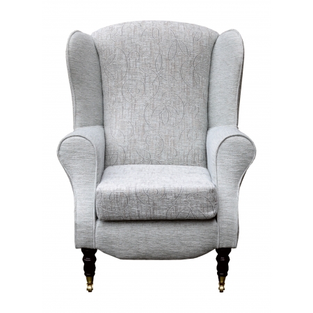 Duchess Wingback Armchair in a Bloomsbury Natural Floral and matching Plain fabric with front castor Legs