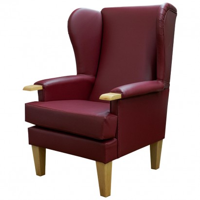 red orthopedic armchair in faux leather